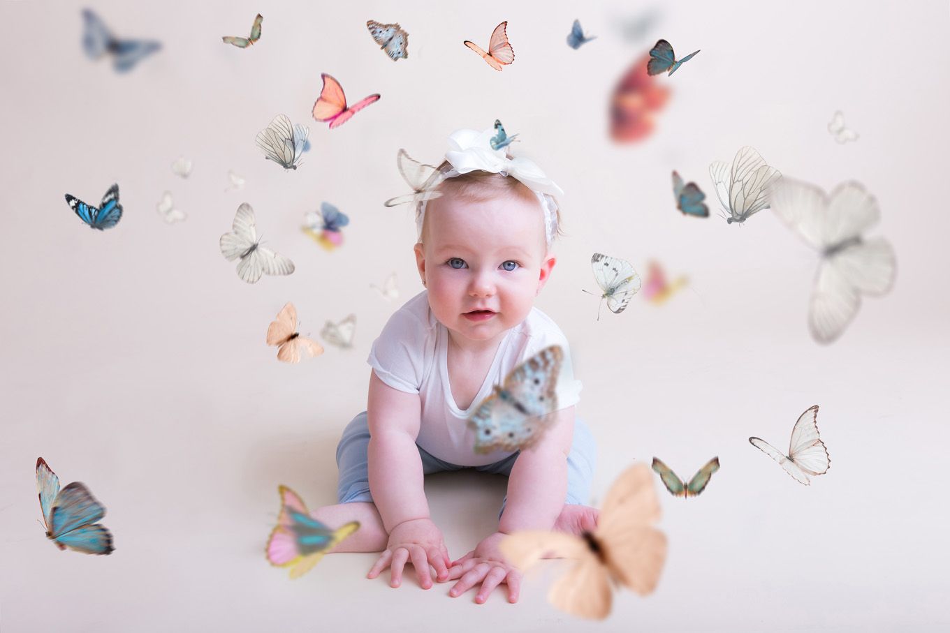 Portrait of a little girl in a studio with backdrop and lighting equipment